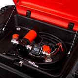 Close-up of a car's undercarriage with visible components like exhaust pipes and battery.