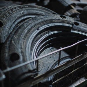 Metal trolly filled with cut and punched recycled tires