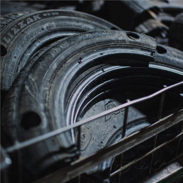 Metal trolly filled with cut and punched recycled tires